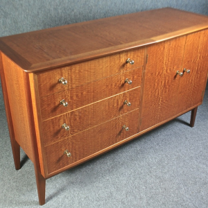 A 1950’s ‘Carousel’ sideboard by Gimson and Slater in beautiful flame-wood