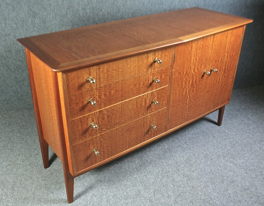A 1950’s ‘Carousel’ sideboard by Gimson and Slater in beautiful flame-wood