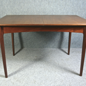 A 1950’s teak extending dining table