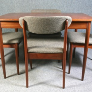 A 1950’s Greaves and Thomas teak extending table and four chairs