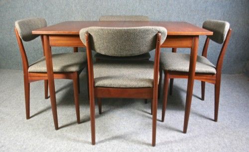 A 1950’s Greaves and Thomas teak extending table and four chairs