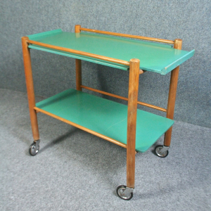 A 1950s green painted wooden trolley.