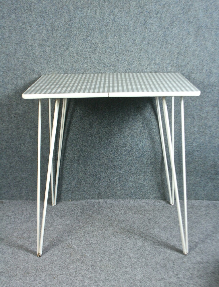 A vintage 1950’s formica grey check table with eiffel legs