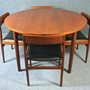 A teak Dalescraft dining table and eight chairs