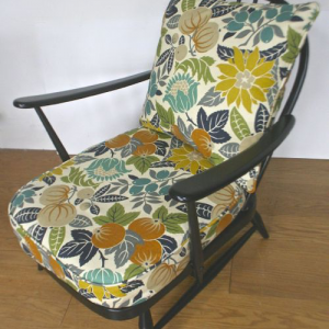 A 1950’s ebonised Ercol cottage chairs in Copacabana by Sanderson