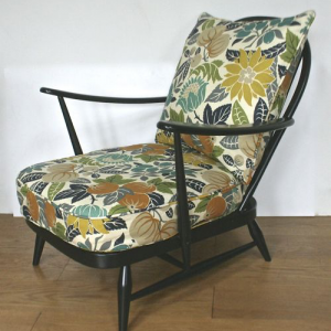 A 1950’s ebonised Ercol cottage chairs in Copacabana by Sanderson