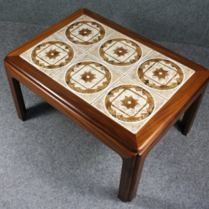 A 1960s small teak tiled top coffee table