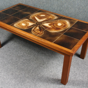 A 1960s teak and abstract floral tile topped coffee table
