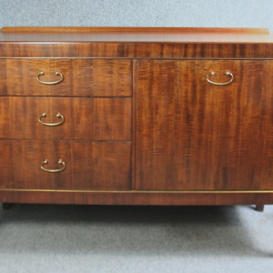 A small teak 1950s sideboard with drop handles