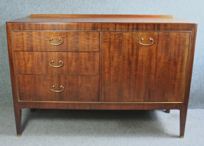 A small teak 1950s sideboard with drop handles