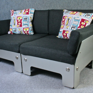 A rare 1970’s two seater aluminium sofa with felt upholstery.