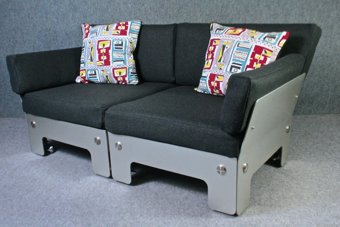 A rare 1970’s two seater aluminium sofa with felt upholstery.