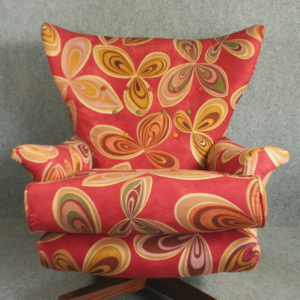 An iconic 1960’s GPlan 6250 wing-back chair in Barbini by Harlequin