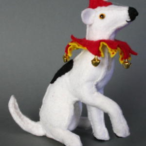 A traditional hand-made felt circus dog