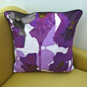 A vintage handmade piped cushion 'Pansies' fabric designed by Howard Carter for Heals rare 1960's fabric.