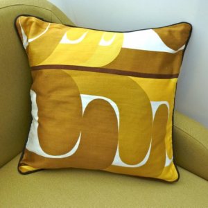 A vintage handmade piped cushion made with rare 1960's fabric.