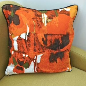 A vintage handmade piped cushion 'Pansies' fabric designed by Howard Carter for Heals rare 1960's fabric.