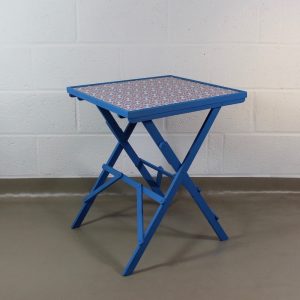 An up-cycled blue folding occasional table covered in Lisbonne Scandi style oilcloth