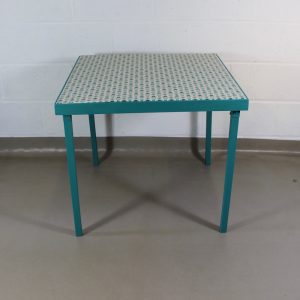 An up-cycled turquoise folding occasional table covered in Scandi style oilcloth