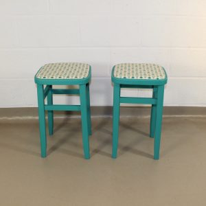 pair of up-cycled turquoise kitchen stools covered in Holly Scandi style oilcloth