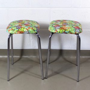 Pair of chrome kitchen stools covered in floraly 1960's style oilcloth