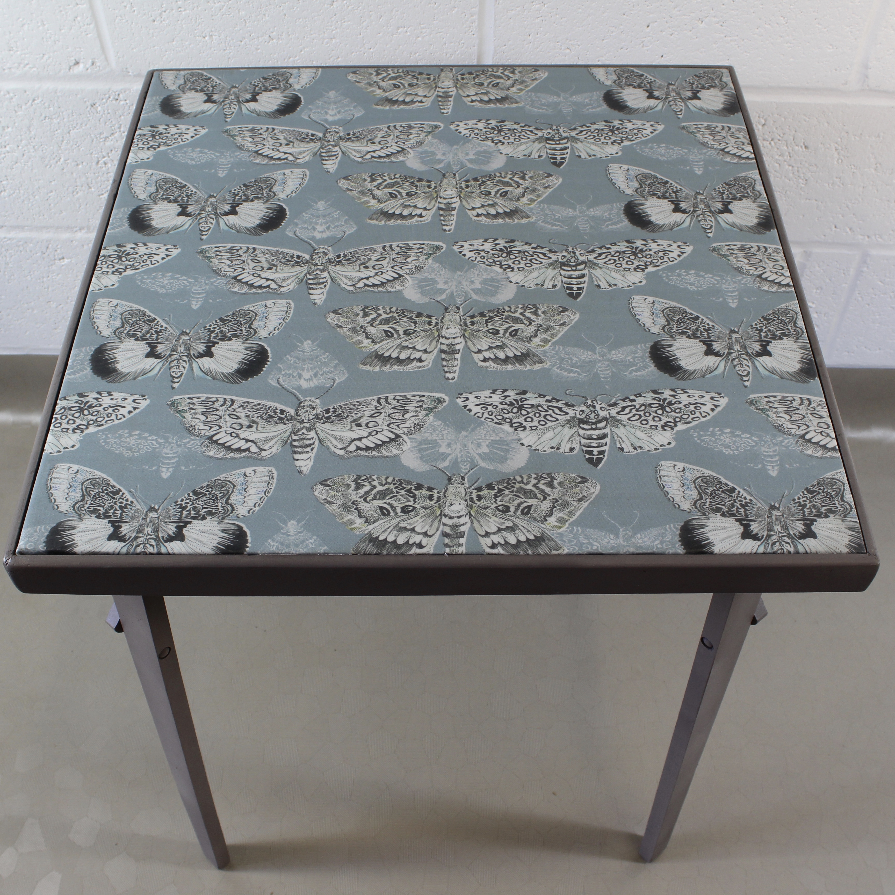 An up-cycled folding occasional table covered in Voyage Nocturnal in seathistle. - Image 4