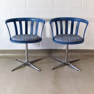 A pair of 1960's swivel dining chairs
