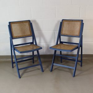 A pair of vintage 1960's rattan folding chairs
