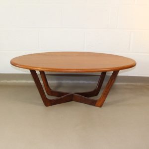 An oval 1960's teak coffee table