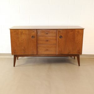 A 1950's walnut sideboard with inset handles