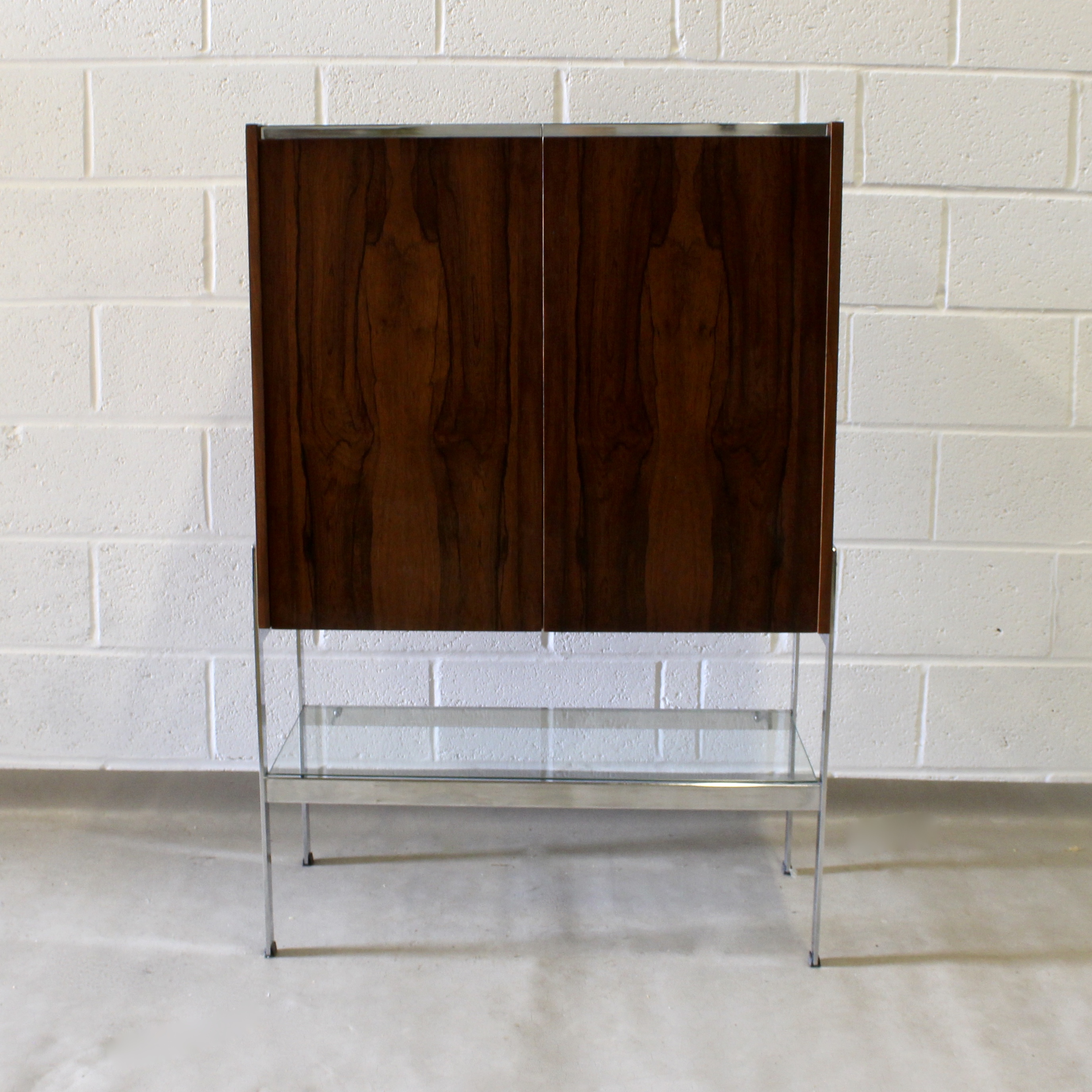 A 1970's Merrow Associates rosewood cocktail cabinet.