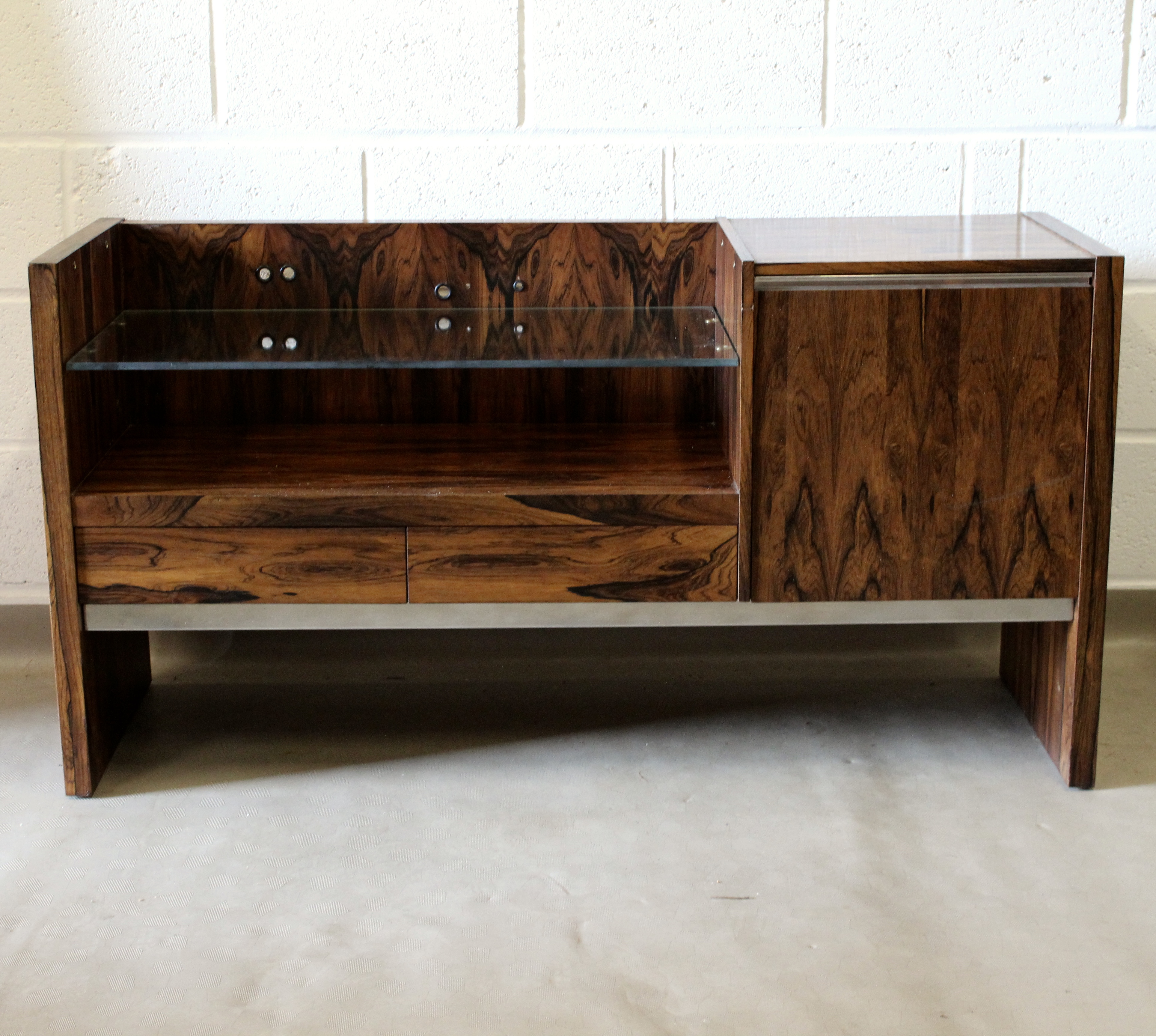 A 1970's unique Merrow Associates rosewood hifi unit record cabinet.