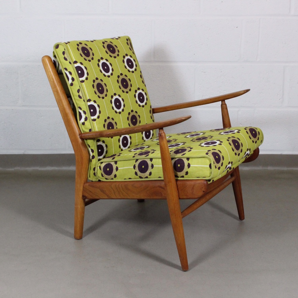 A 1950's midcentury chair upholstered in Clarke and Clarke citrus 'celeste' fabric