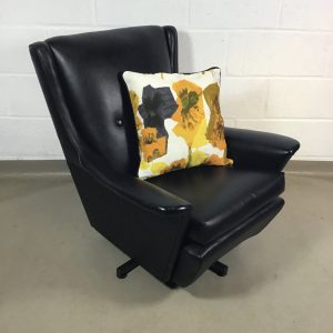 A lovely 1950s/1960s black Vinyl  swivel arm chair.