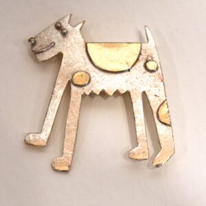 'Dog ' brooch in silver and gold plate