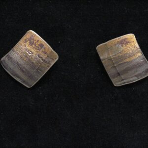 Small square studs in blue, gold and  purple.