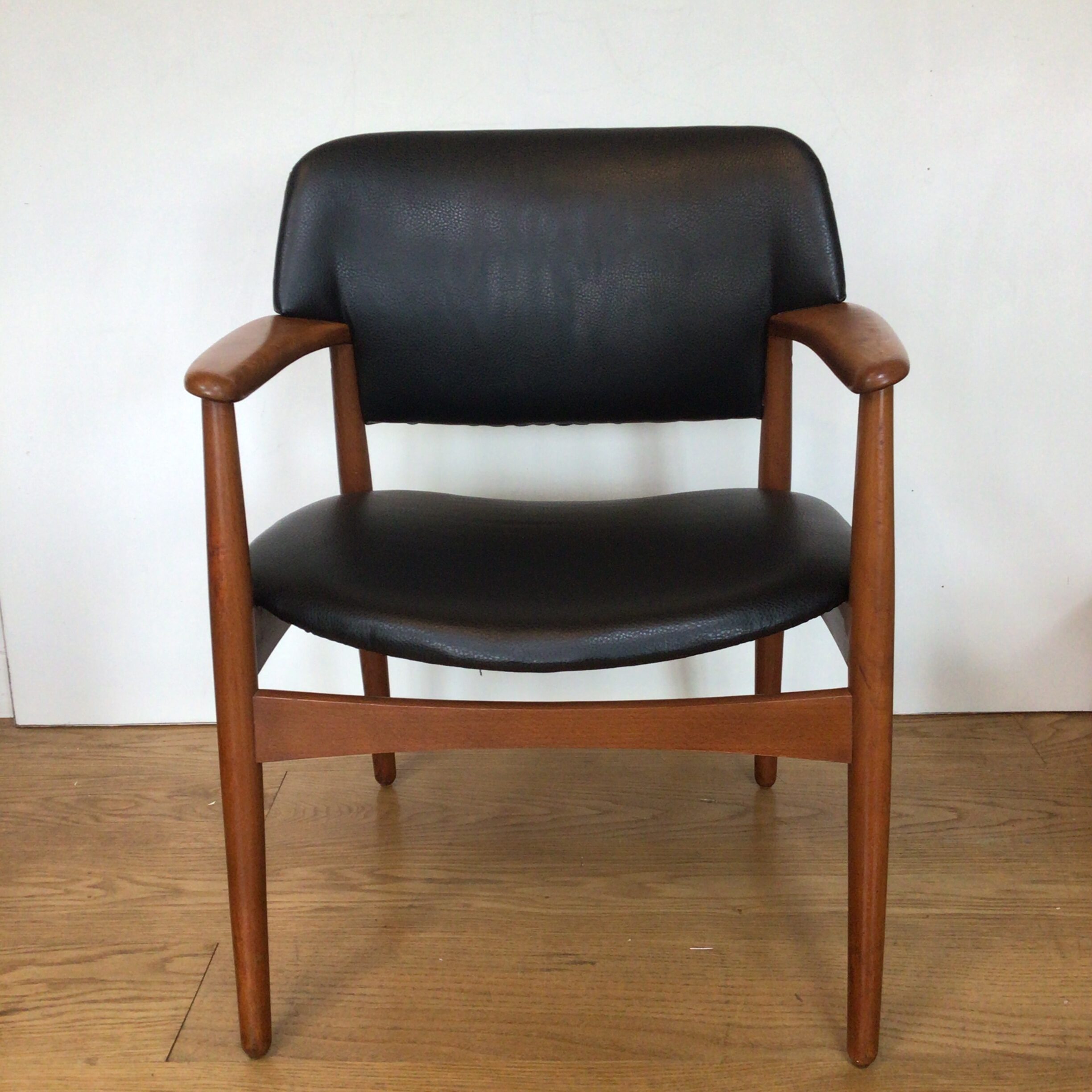 A Danish Fritz Hansen teak 6302 comfort chair designed by Einar Larsen & Aksel Bender Madsen