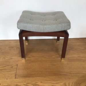 A 1970's G-Plan mahogany stool with light blue buttoned upholstery