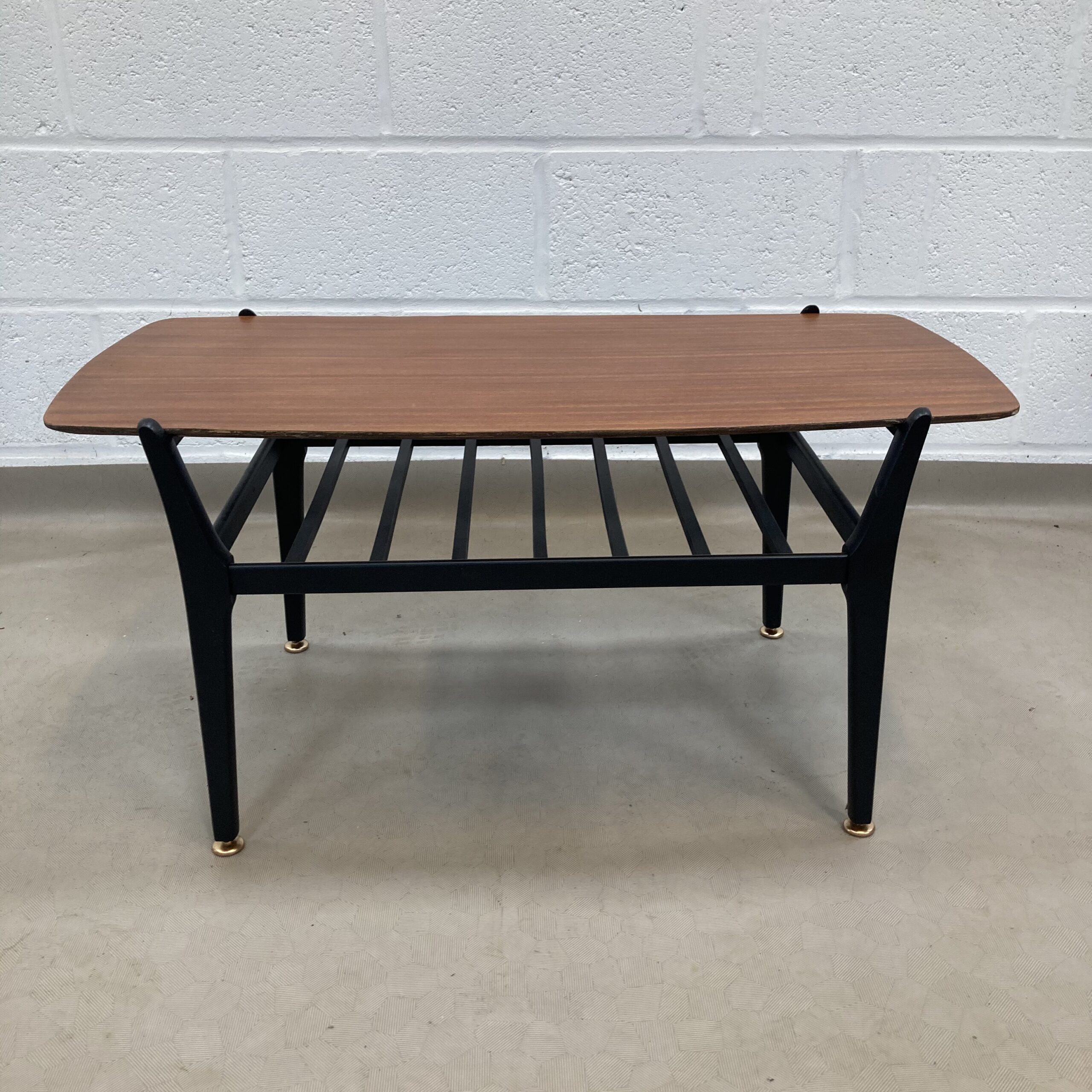 A Nathan teak and black two tiered Coffee table