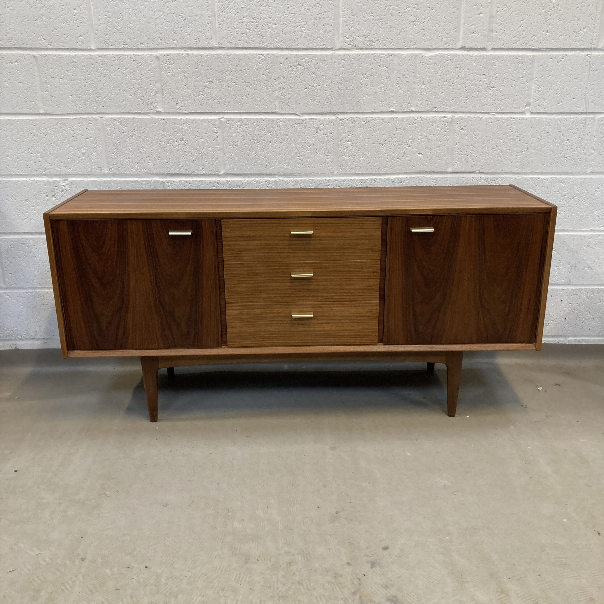 A lovely midcentury walnut and teak Wrighton sideboard