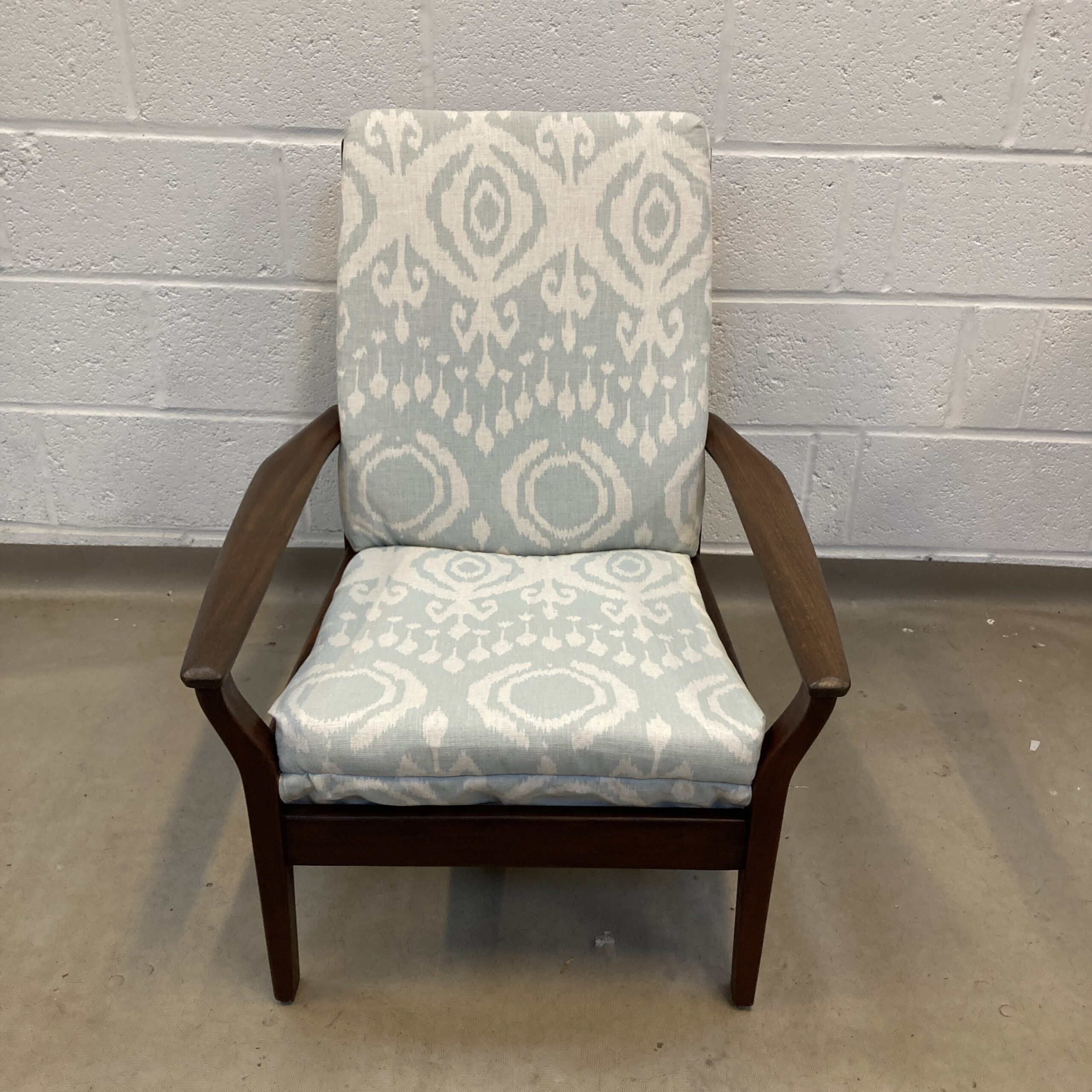 A 1960s Cintique teak arm chair newly upholstered in a light ikat fabric