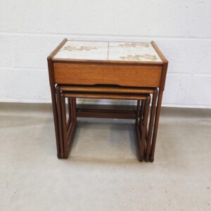 A G-plan 1970's nest of tables top with tiled topped with drawer