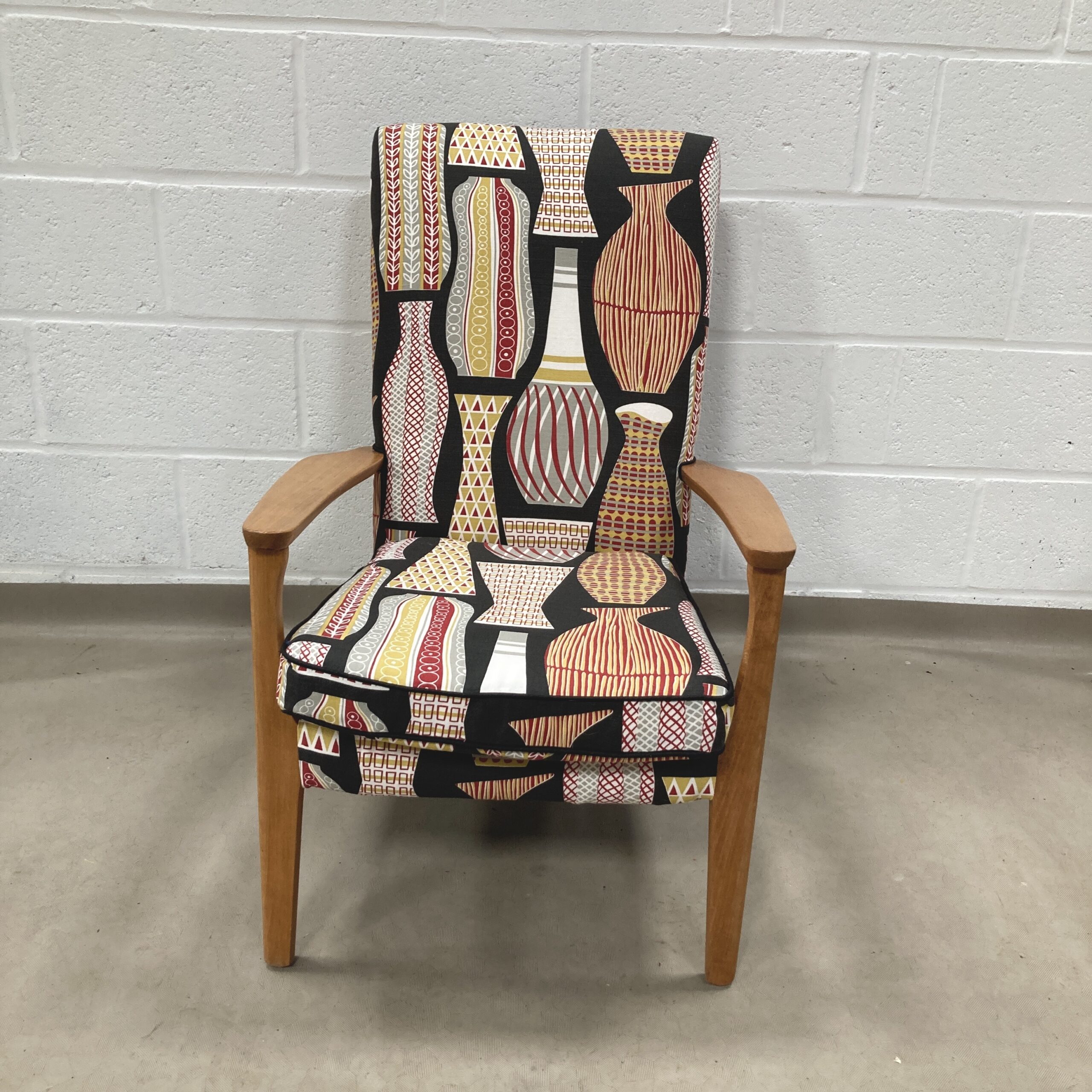 A 1960’s Parker Knoll chair recovered in sandersons Hayward (Black)