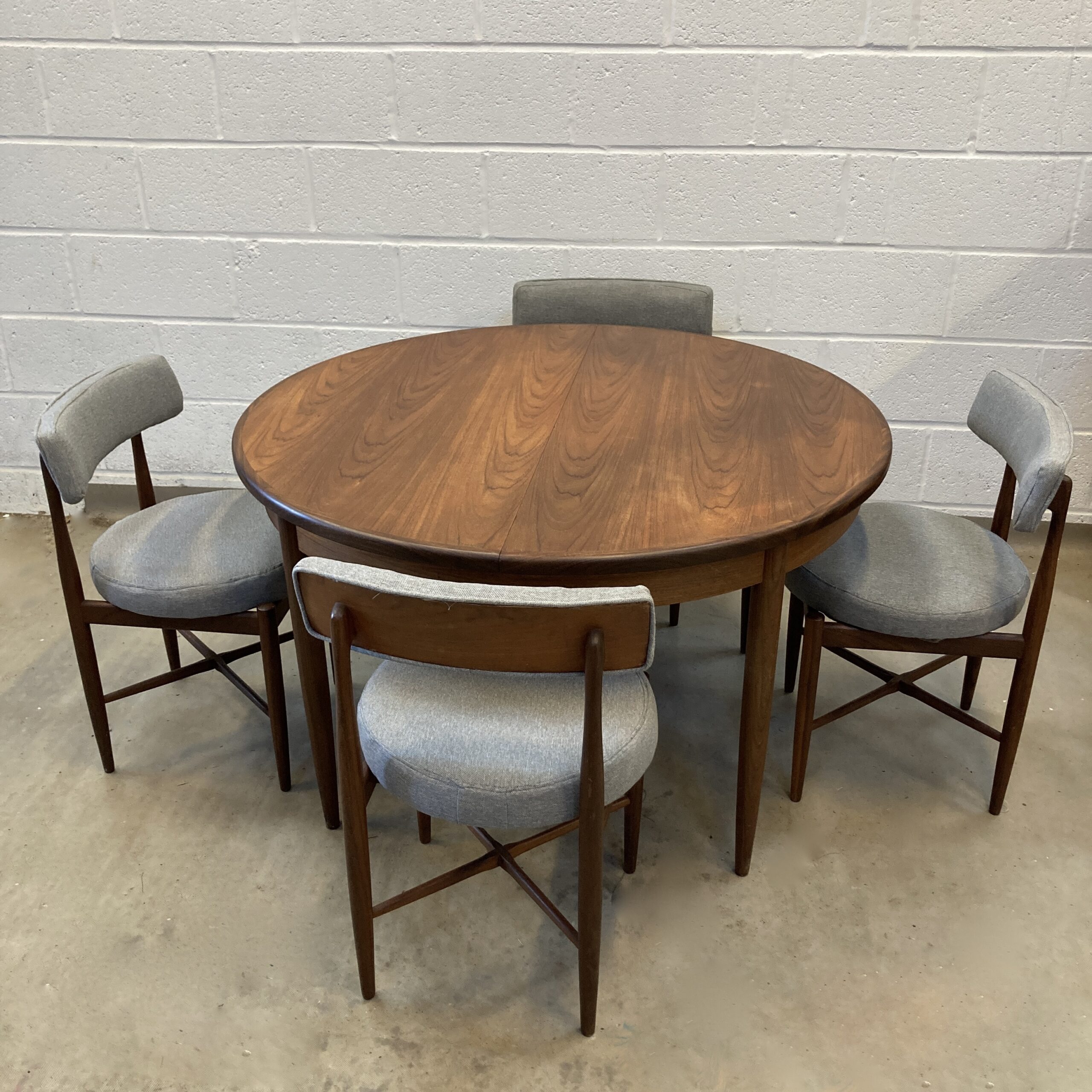 A 1960s G-plan fresco table and four Victor Wilkins designed Fresco chairs