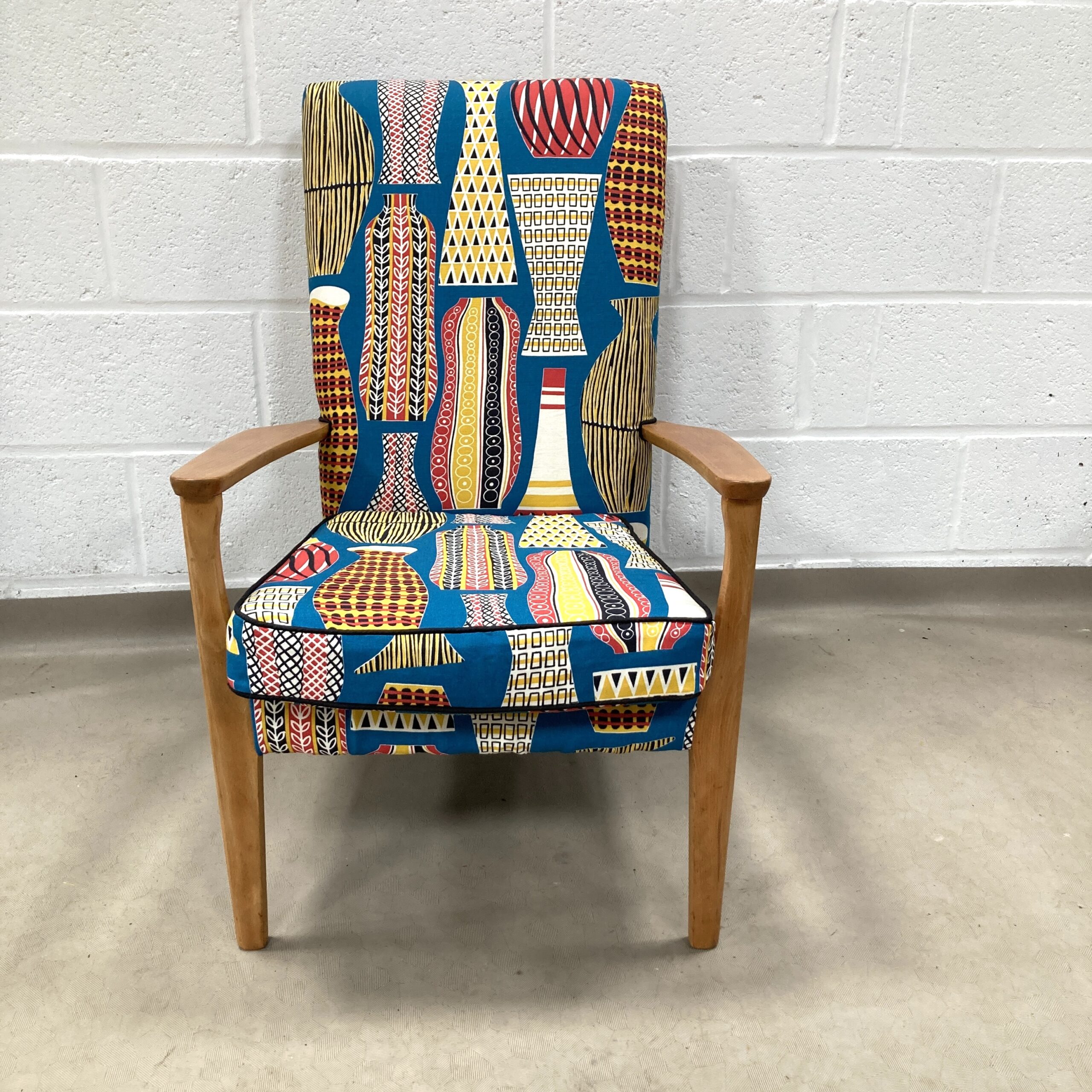 A 1960’s Parker Knoll chair recovered in sandersons Hayward