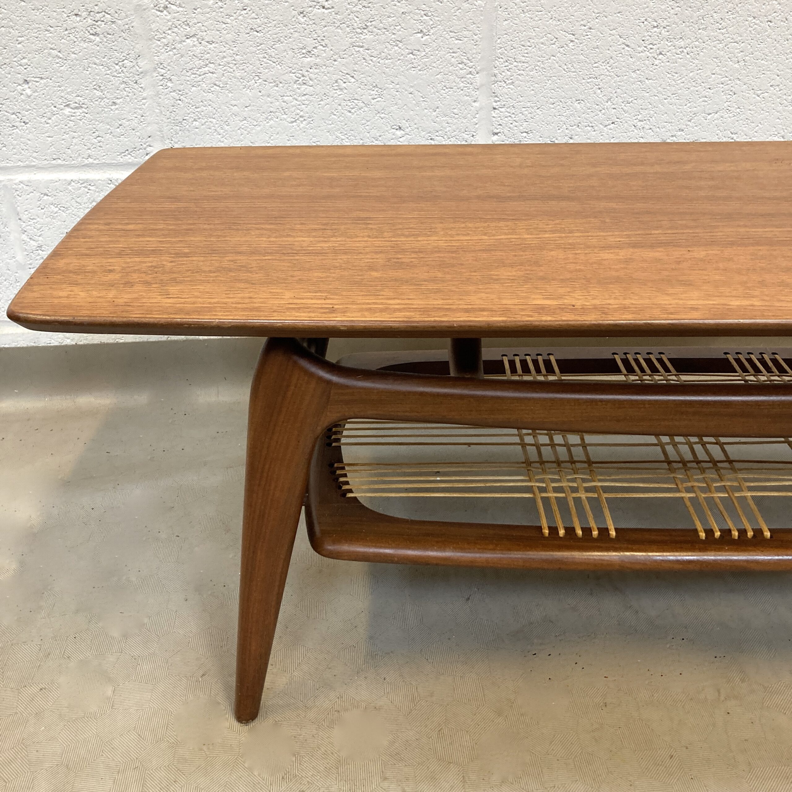 A 1950’s Louis Van Treefelen For WeBe Meubel Danish teak coffee table with cane woven magazine rack. - Image 6