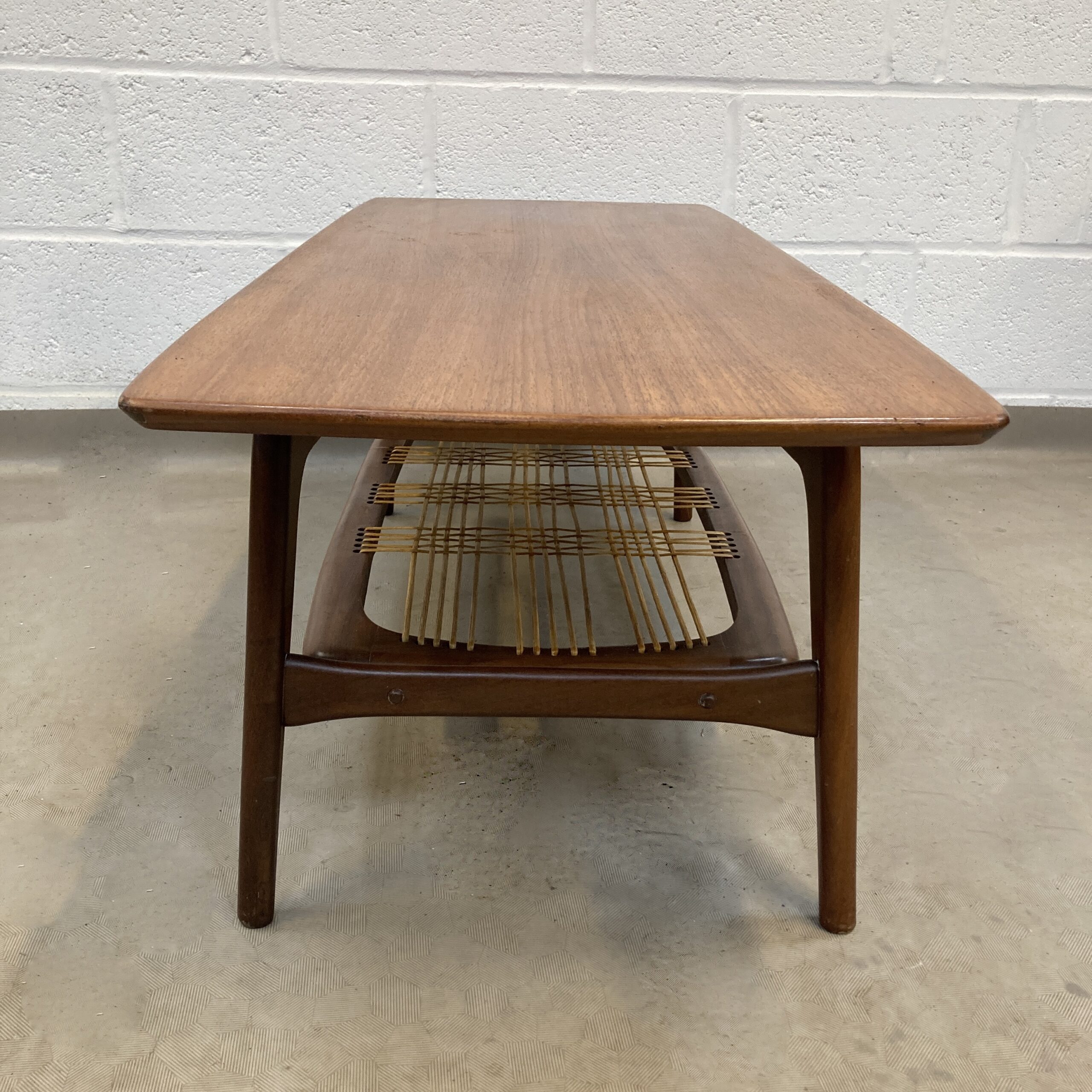 A 1950’s Louis Van Treefelen For WeBe Meubel Danish teak coffee table with cane woven magazine rack. - Image 5