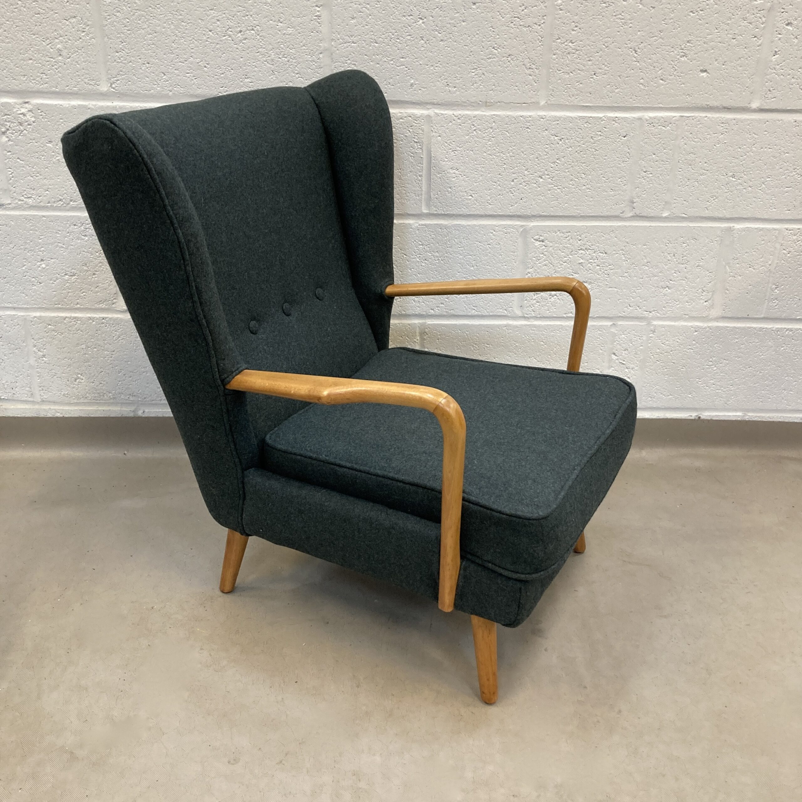 A 1950s Howard Keith Bambino reupholstered Armchair in Italian green felt