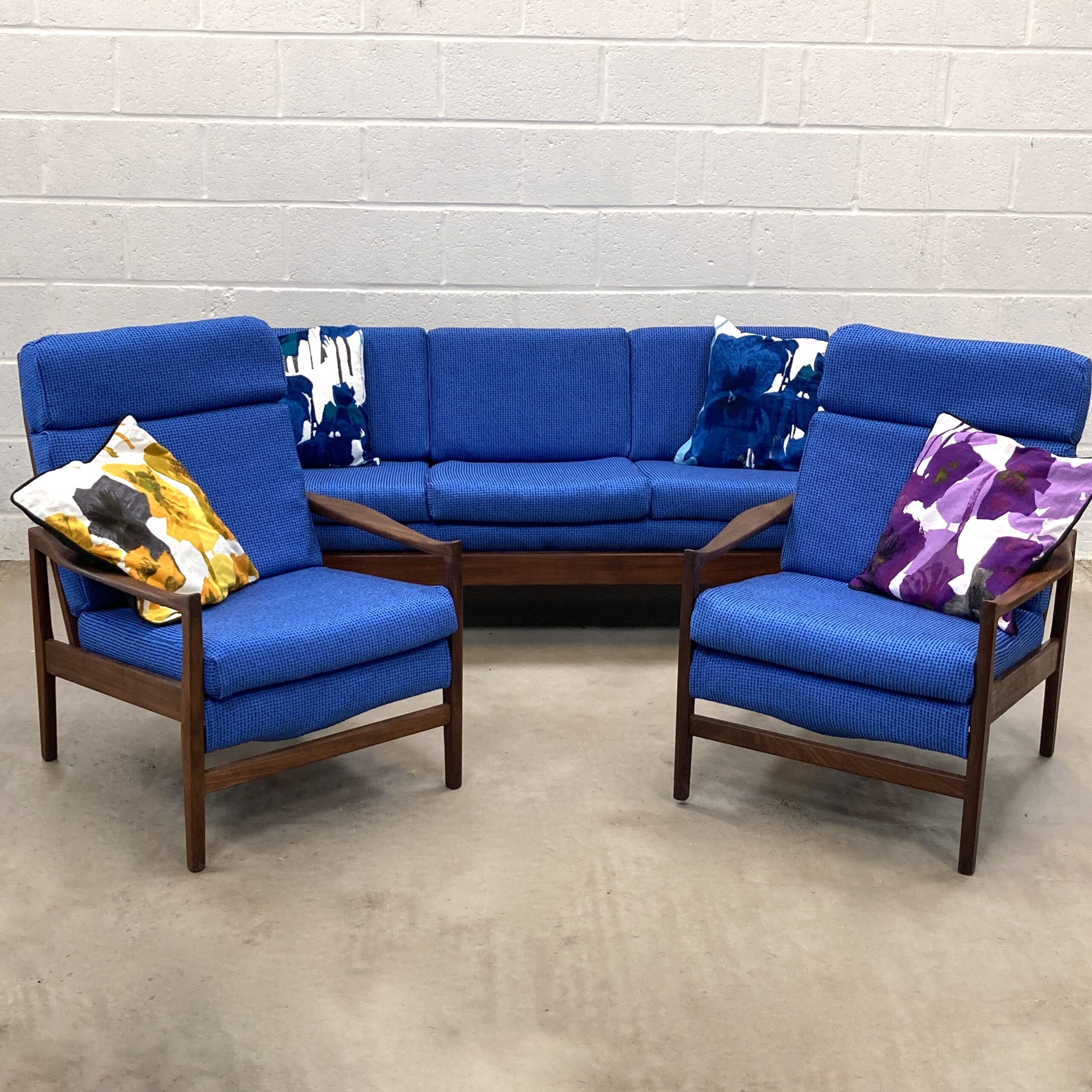 A 1960s Cintique Loungemaster sofa suite reupholstered in a wool mix Abbotsford mill fabric.